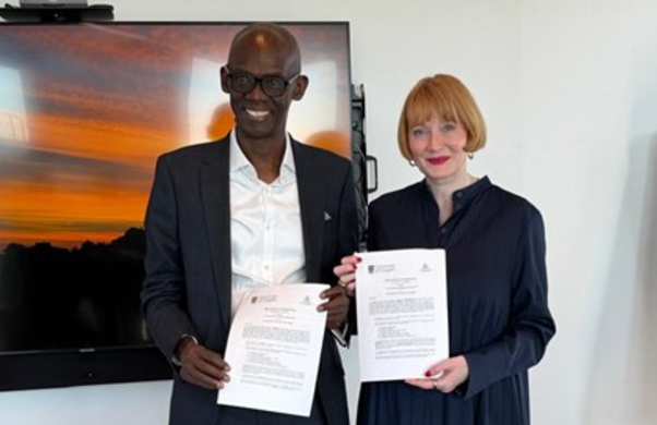 Professor Ahmed Adamu, Vice Chancellor of Ahmadu Bello University (ABU), and Professor Rachel Sandison, Deputy Vice Chancellor for External Engagement and Vice Principal for External Relations at the University of Glasgow, hold signed copies of the Memorandum of Understanding (MoU) following the agreement ceremony at the University of Glasgow in April 2026.