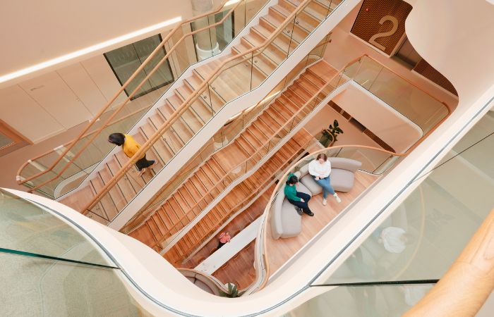 An interior image of a building with people interacting