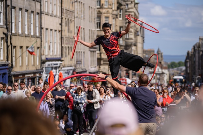 Edinburgh Festival Fringe street scene. Credit David Monteith-Hodge Photographise A scene of people enjoying a performance at Edinburgh Festival Fringe. Credit David Monteith-Hodge Photographise