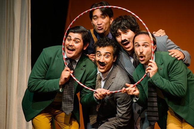 Edinburgh Festival Fringe - Tiny Little Town. Credit David Monteith-Hodge Photographise An image of five people on stage at the Edinburgh Festival Fringe with a hula hoop. Credit David Monteith-Hodge Photographise