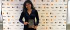 Laavanya holds her Herald Award for Outstanding Contribution From a University Student