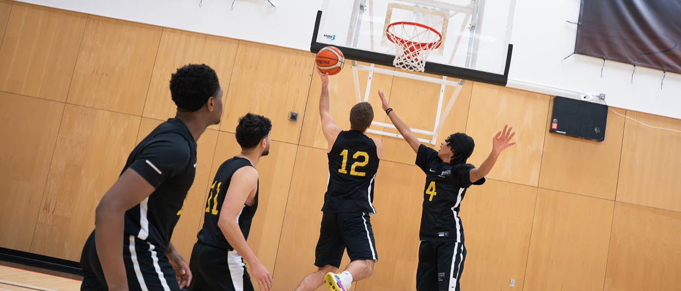 students playing basketball
