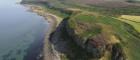 Aerial photograph of Hillfort showing coastline and sea