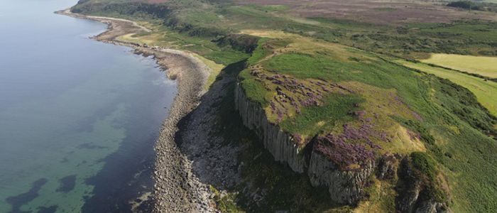 Aerial photograph of Hillfort showing coastline and sea