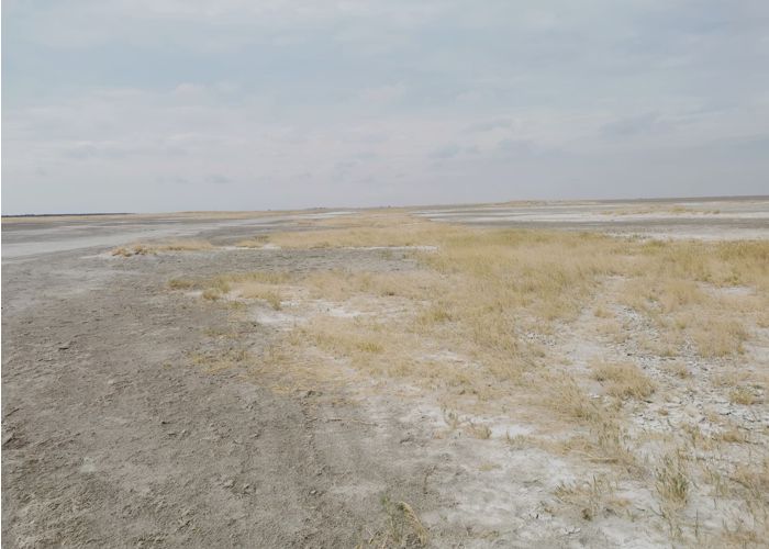 Landscape of salt pans and sky