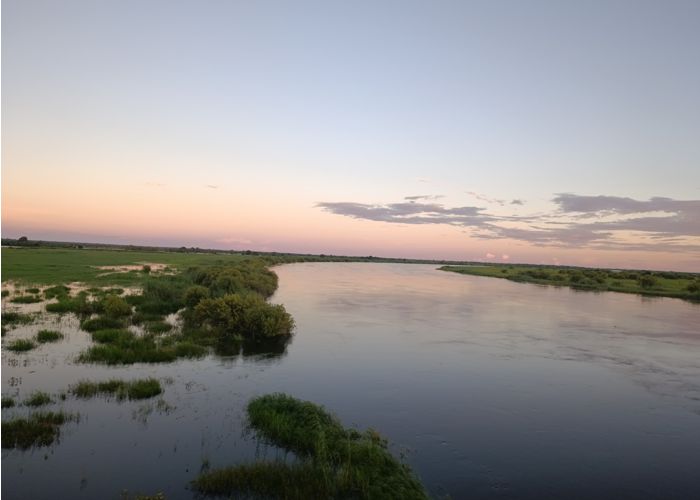 View of the sun setting over the Okavango Delta