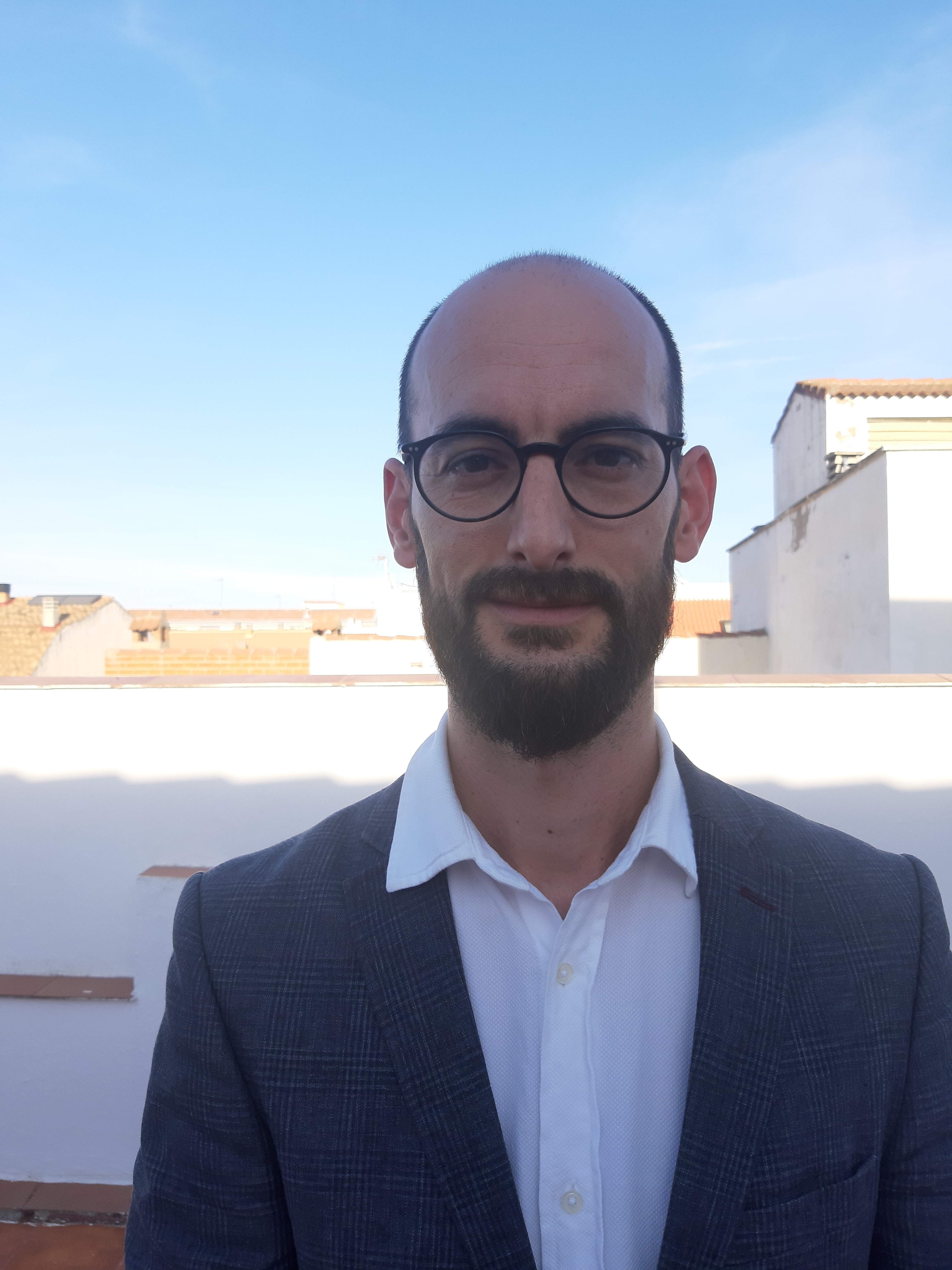 A man in glasses outside