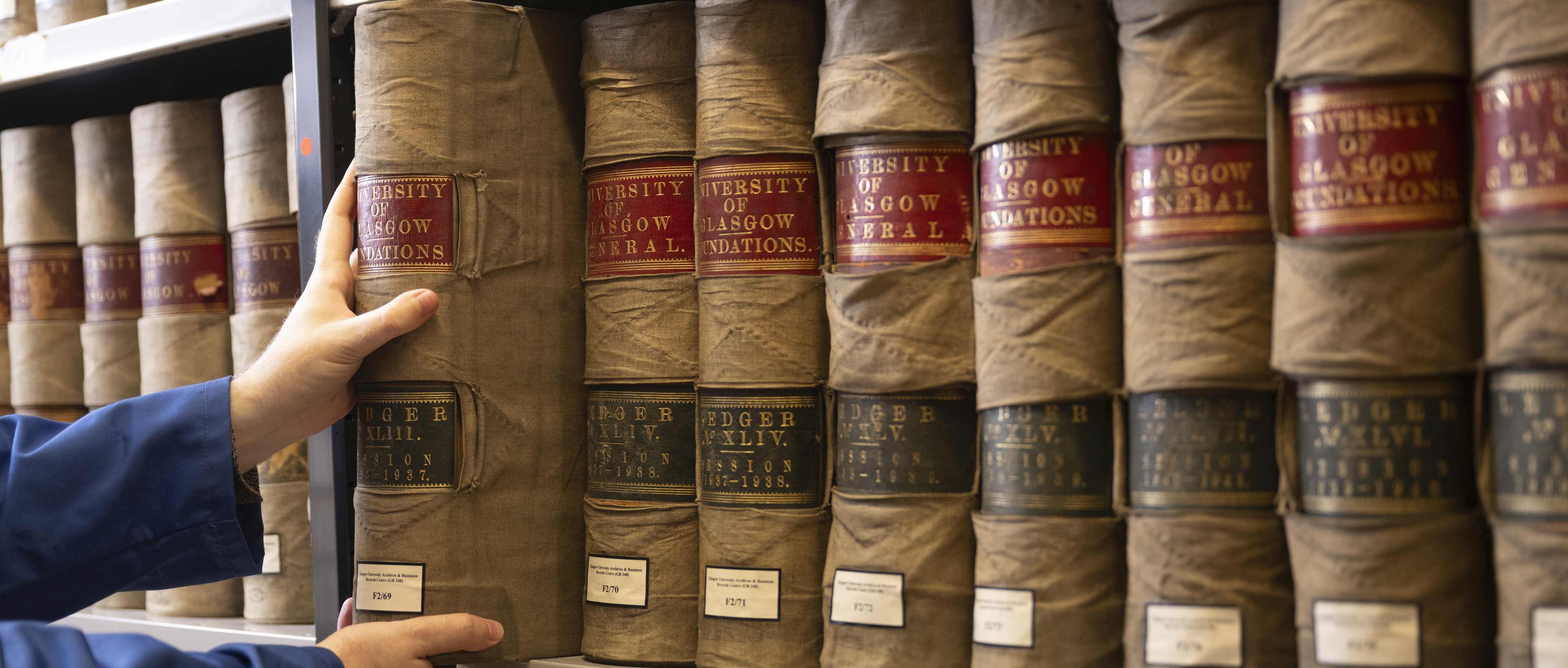 University of Glasgow volumes on a shelf