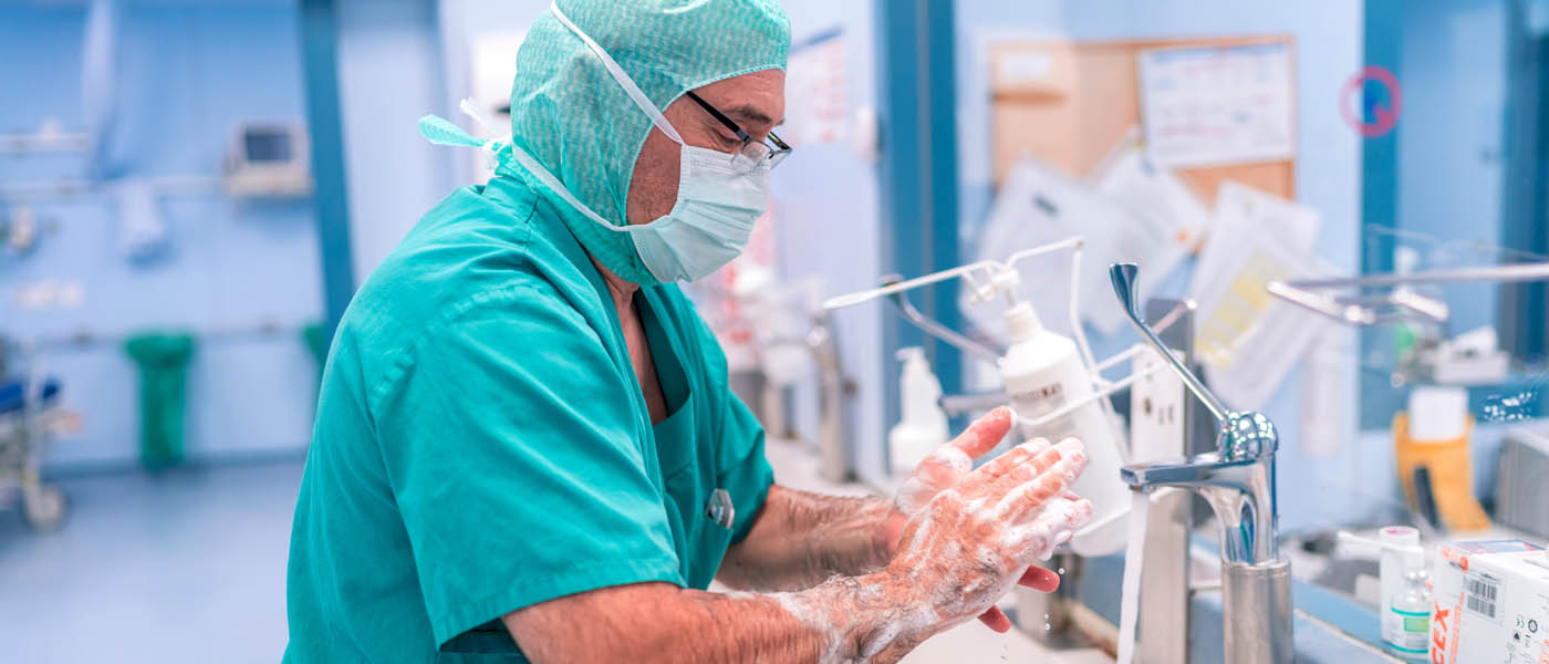 A surgeon washing his hands with antiseptic soap
