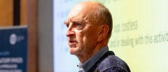 A male lecturer in profile