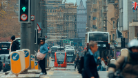Edinburgh street with trams, buses and people