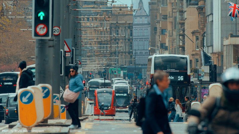Edinburgh street with trams, buses and people