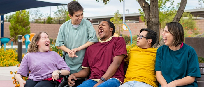 A group of happy young people with learning disabilities
