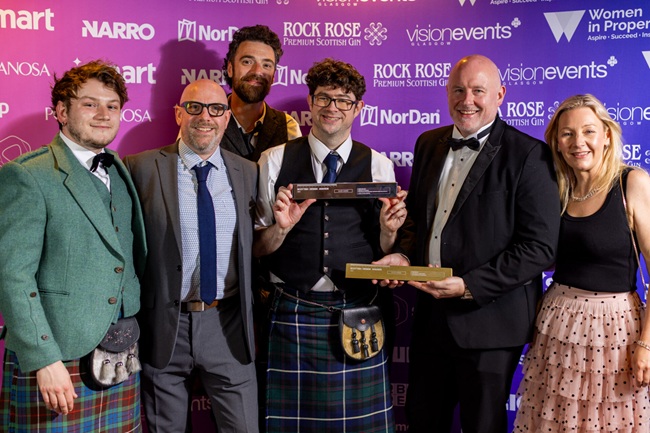 L-R: Conor Fraser (UofG); Alastair Miller (Float); Alex McRoberts (Float); Prof Neil McDonnell (UofG), Andy Pennington (Float) and Prof Pauline Mackay (UofG) A group of people stand with a Scottish Design Award