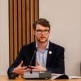 student speaking at a panel