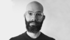 A black and white head and shoulders portrait shot of leandro lemgruber