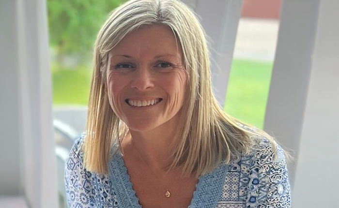 Lynn Renfrew profile photograph in front of a window