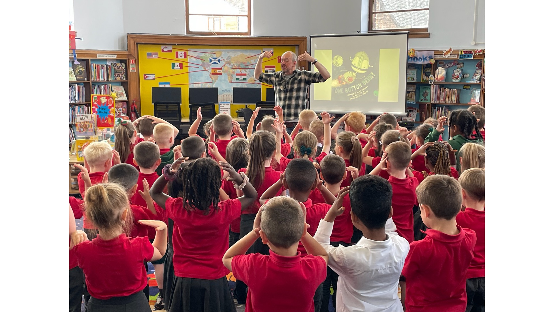Photograph of an author event in a library for schoolchildren.