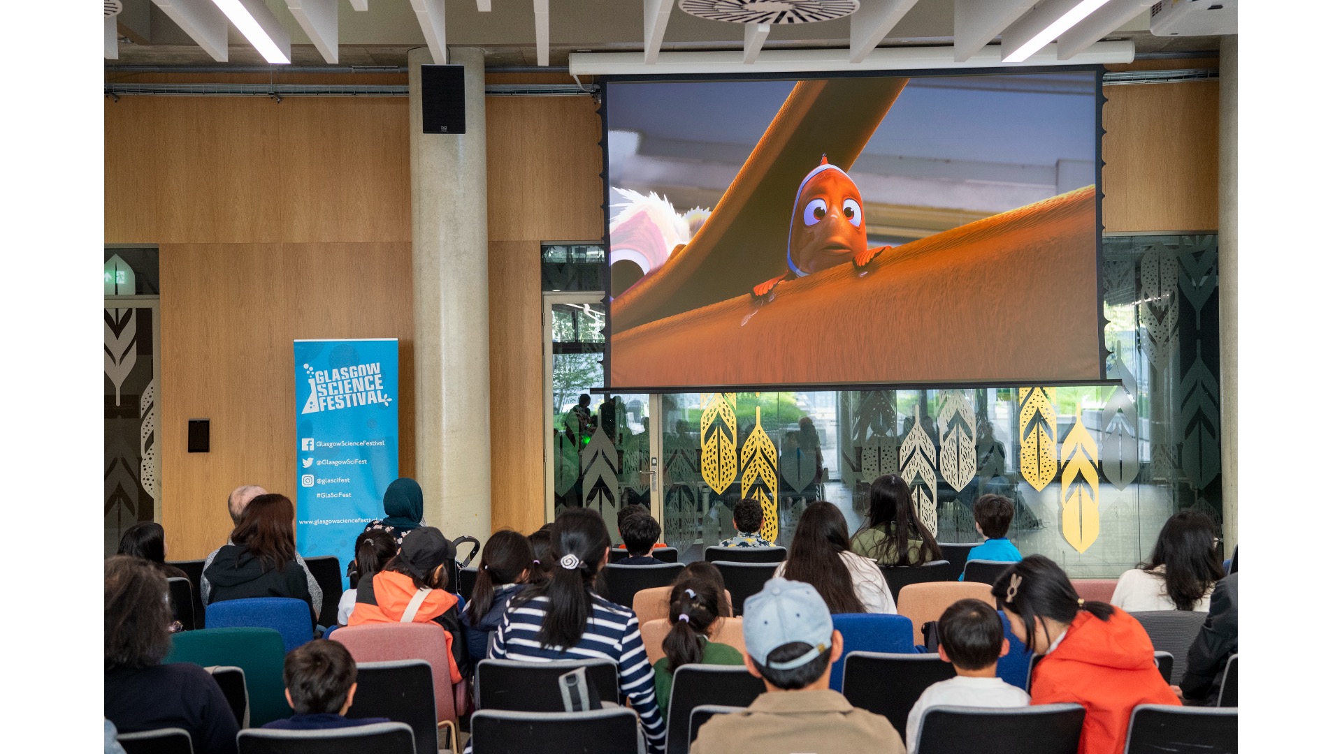 Photograph of people watching the Finding Nemo film.