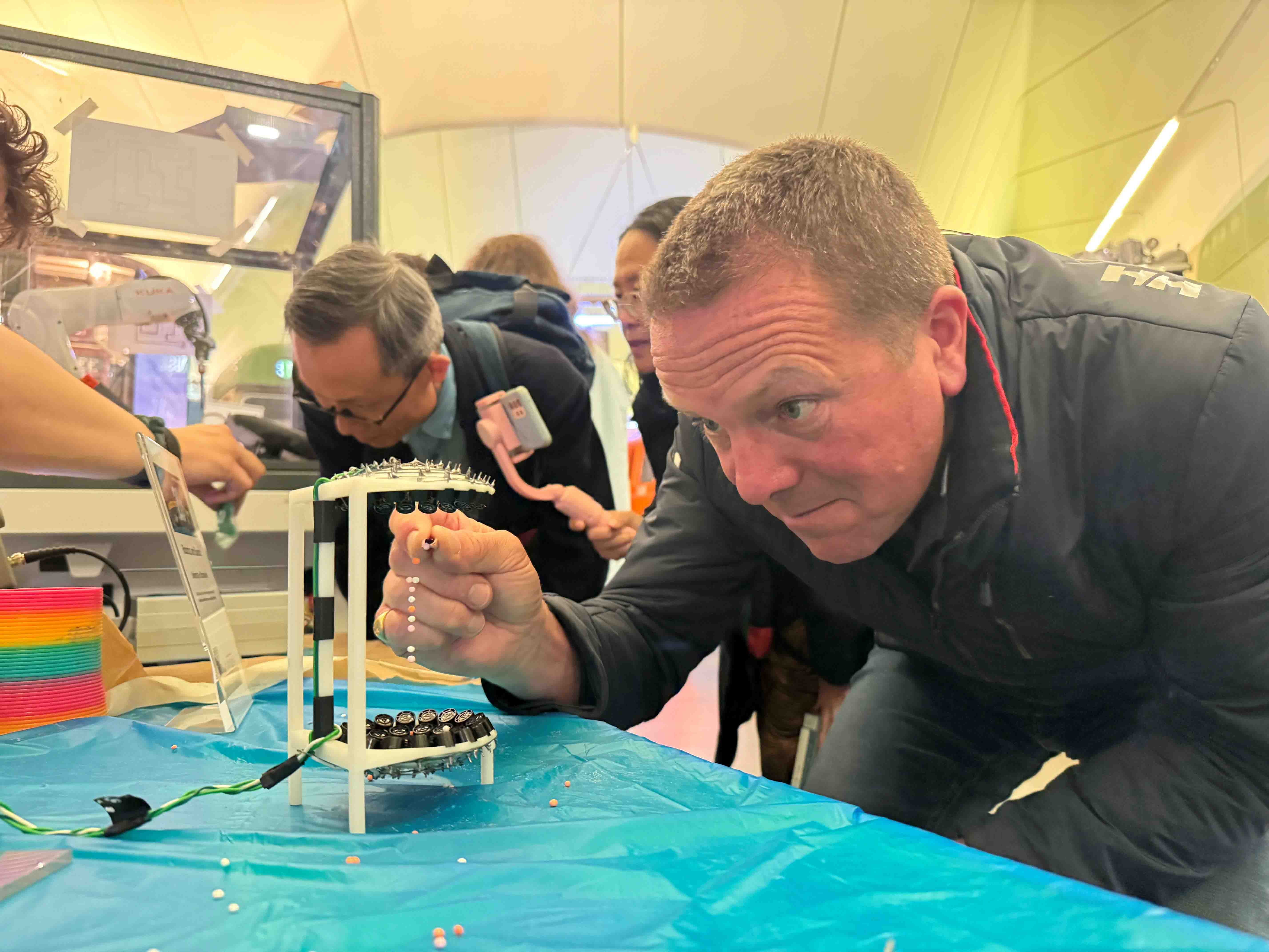Photograph of a man taking part in a robotics activity