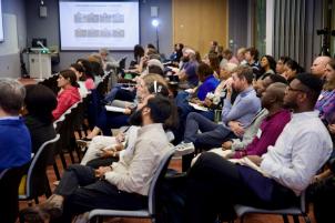 Attendees listen to presentations at the GHE conference