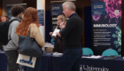 Professor Simon Milling speaks to visitors at the Immunology information stand during the University’s Undergraduate Open Day.