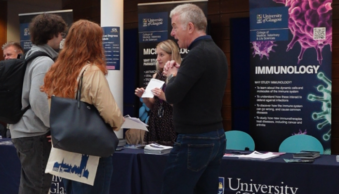 Professor Simon Milling speaks to visitors at the Immunology information stand during the University’s Undergraduate Open Day.