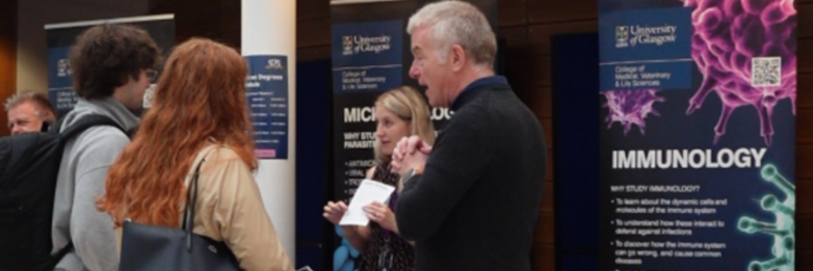 Professor Simon Milling speaks to visitors at the Immunology information stand during the University’s Undergraduate Open Day.