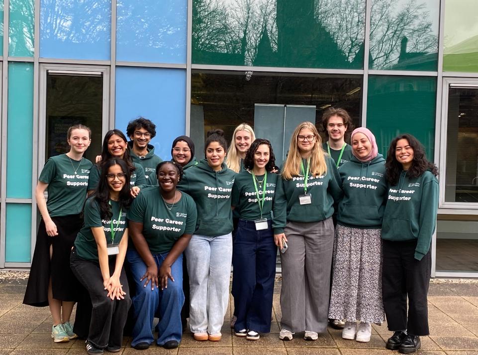 A group photo of some of our Peer Careers Supporters in their green hoodies.