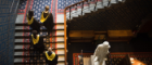 A photo of students in graduation robes ascending the Randolph staircase for graduations