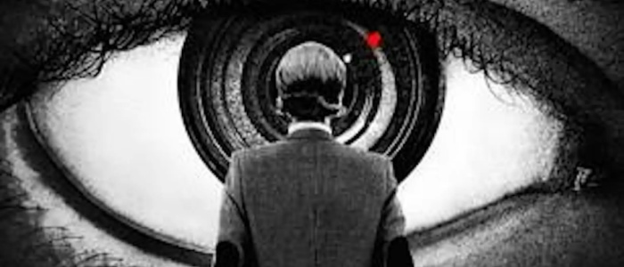 Poster for Orwell 2+2=5 showing a man in a suit from behind as he faces a giant eye