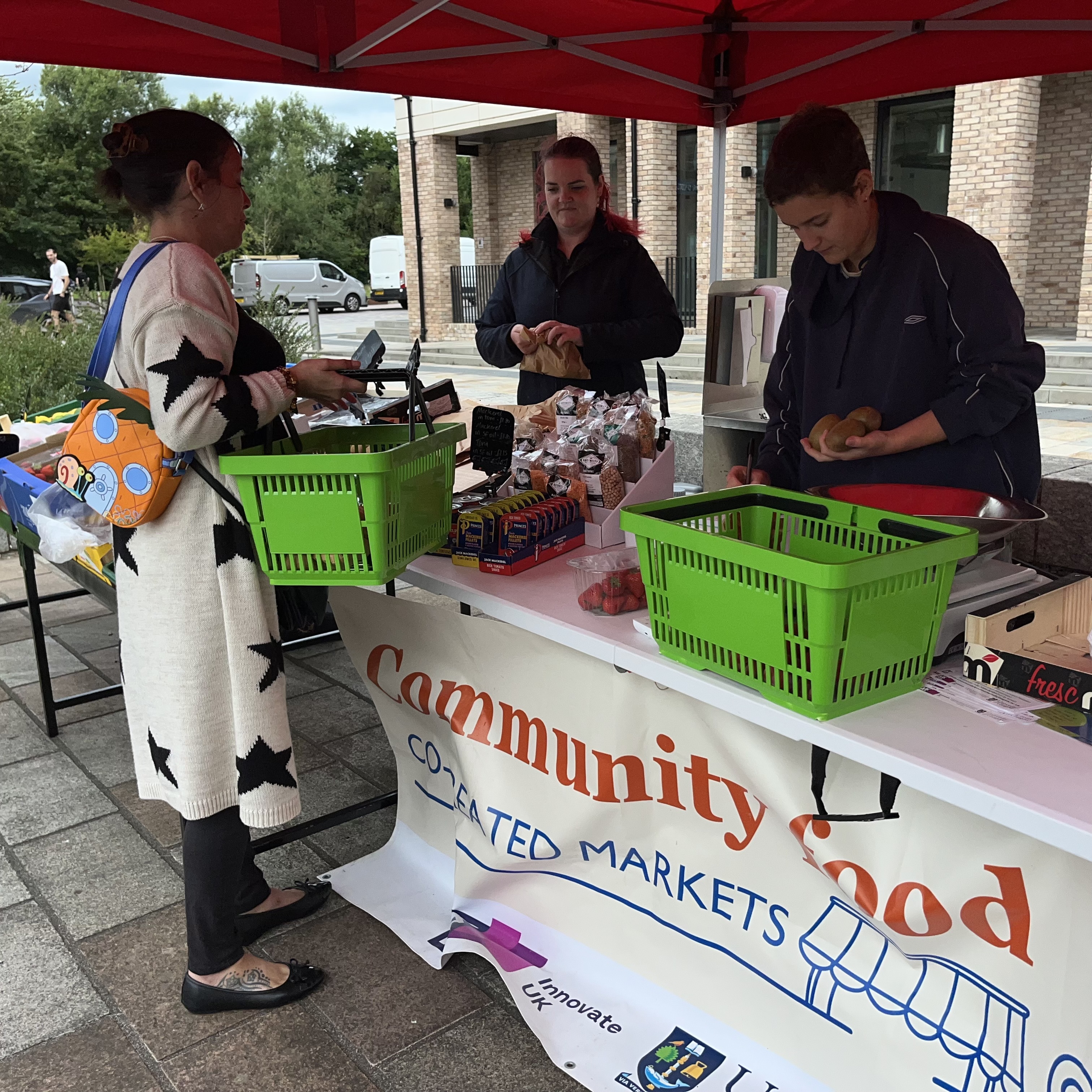Govan Market Customer being served at the till