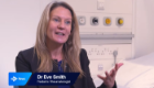 Dr Eve Smith, Sii Paediatric Rheumatologist, speaking and gesturing during an interview with STV News in a hospital setting.
