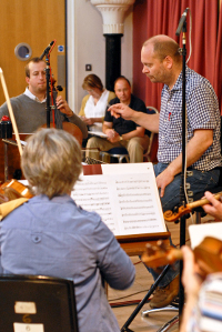 Kennedy Aitchison (conductor) and members of the Orchestra of Scottish Opera recording the musical soundtrack