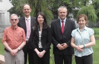 David Smith and Clare McManus (centre) with KIMEP officials