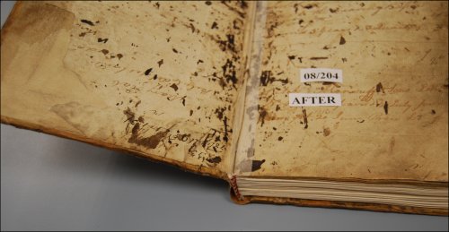 This photograph shows the textblock attached to the cover of the logbook after conservation treatment. (GUAS Ref: UGC 182. Copyright reserved.) 