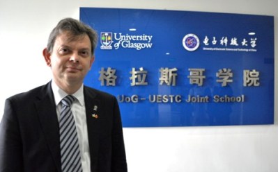 Principal Anton Muscatelli in front of the UESTC-UoG sign, Chengdu, 16 May 2013