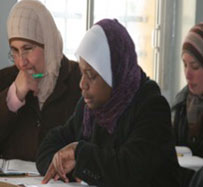 Three women in a classroom