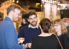 Colleagues chatting at an event