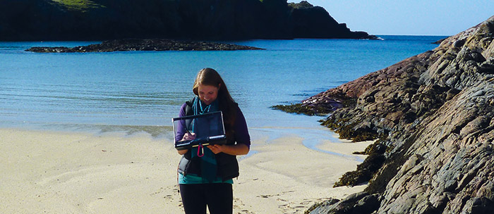 Geography student on beach