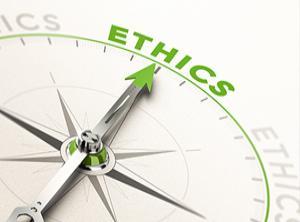 Compass with needle pointing to the word ethics