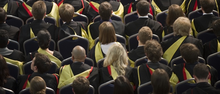 Graduates sitting in Bute Hall
