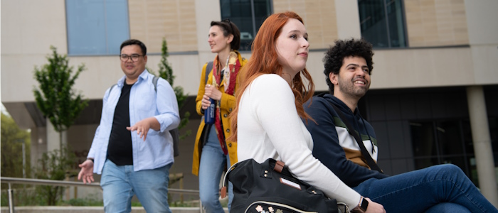 Students sitting outside the Fraser Building