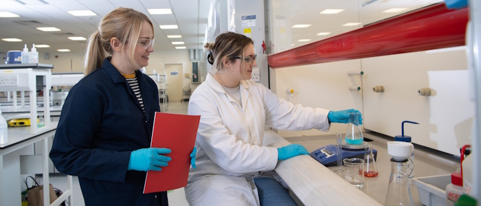 Researchers using lab equipment