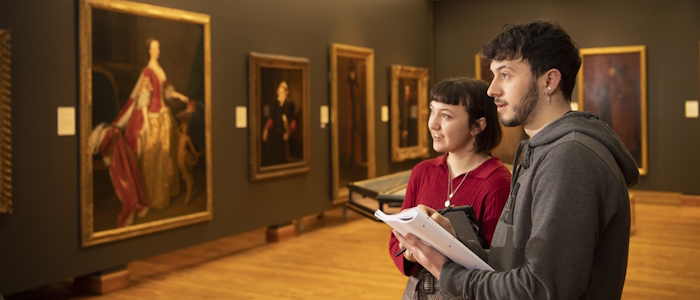 Students viewing art in the Hunterian gallery