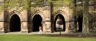 Two students passing the cloisters