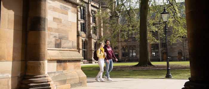 Students walking through the cloisters