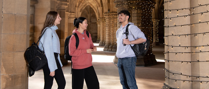 Students walking through the cloisters