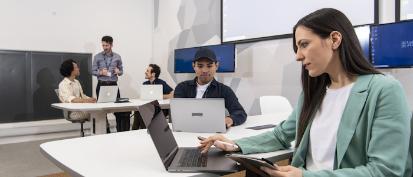 Students studying at desks in the Hugh Fraser Suite