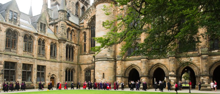 Students at graduation walking in the quadrangle